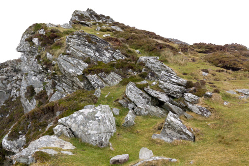 rocks on gras hill on white background - seen in northern ireland