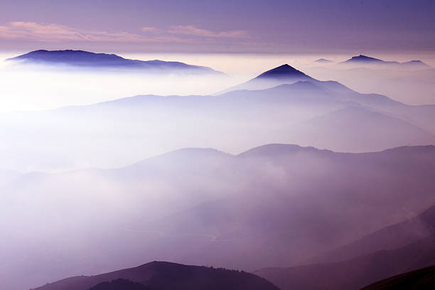 Evening over the misty mountains stock photo