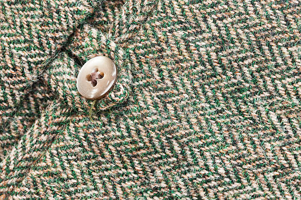 Harris tweed pocket Detail on the rear pocket of herringbone pattern Harris tweed trousers worn for traditional outdoor country pursuits. tweed stock pictures, royalty-free photos & images