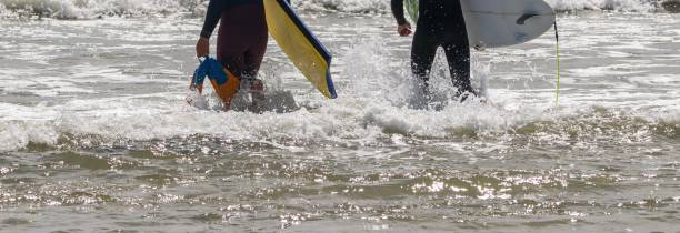 istock Men Preparing to Surf in the Atlantic Ocean 1849506208