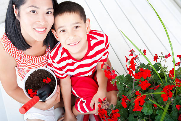 istock Mother and son gardening 184950854