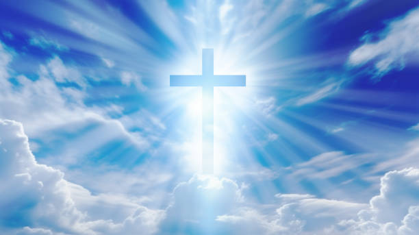 istock Christian cross with god ray on blue sky 1849509384