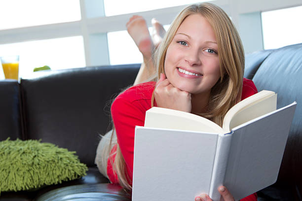istock Smiling Caucasian female holding a book 184951011