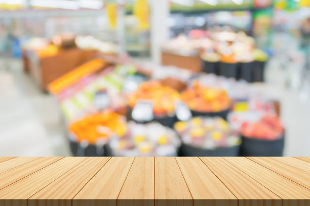 istock Empty wood table top with supermarket blurred background for product display 1849513033