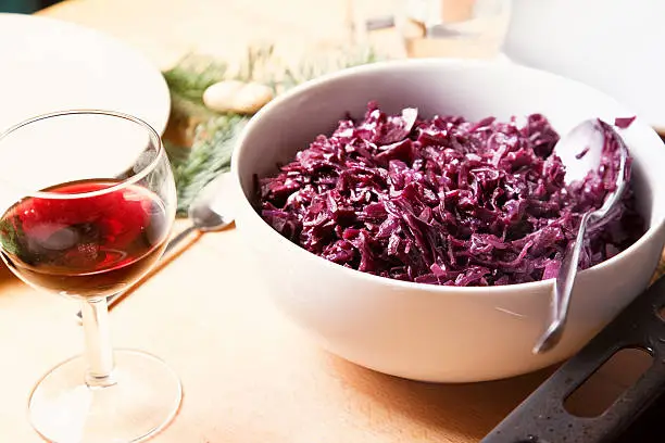 red cabbage in a bowl on table, vegetable  sidedish in winter