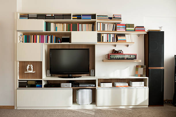 TV wall unit bookshelf a wall unit in a livingroom with bookshelves and cupboardssimilar images: dvd player stock pictures, royalty-free photos & images