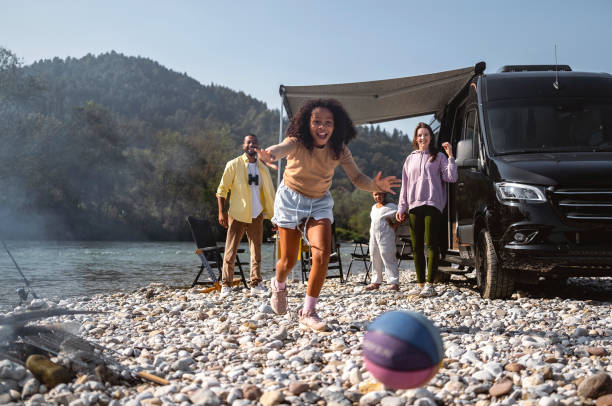 istock Family camping by the river 1849525863