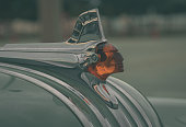 close up of an antique car's hood ornamement