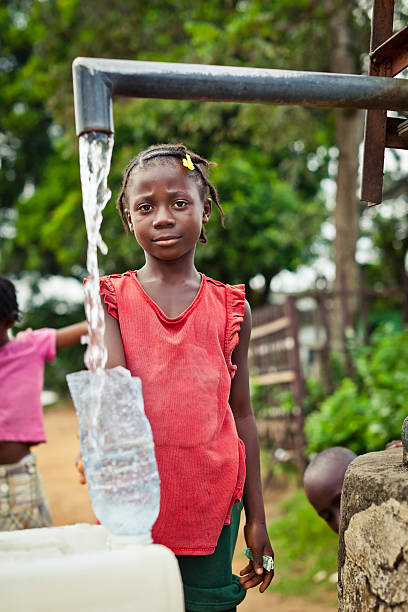 istock African Girl By Water Pump 184952592