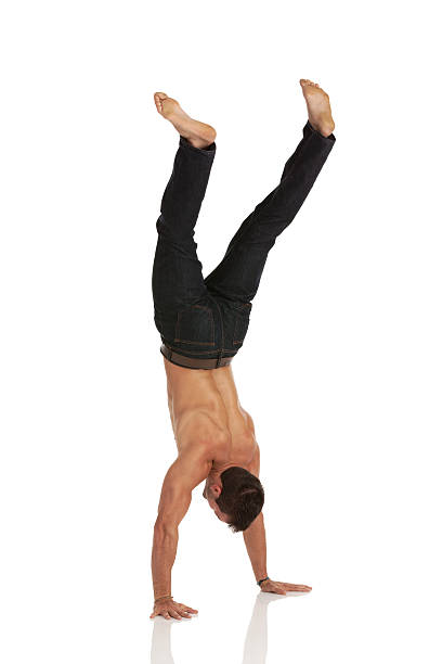 Man doing hand stand Man doing hand standhttp://www.twodozendesign.info/i/1.png handspring stock pictures, royalty-free photos & images