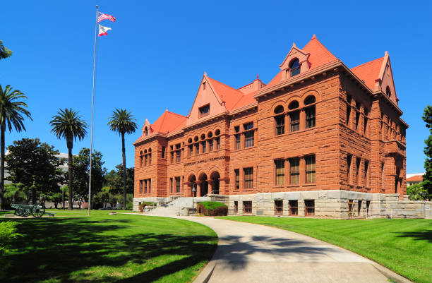 Old Orange County Courthouse and palm trees in the sun