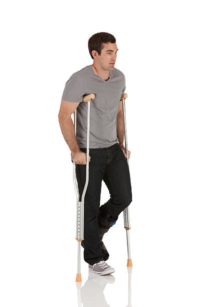 istock Injured young man on crutches 184952975