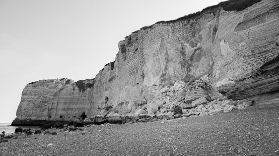 Chalk cliffs near Etretat (Normandy France) on a sunny day in summer, black and white