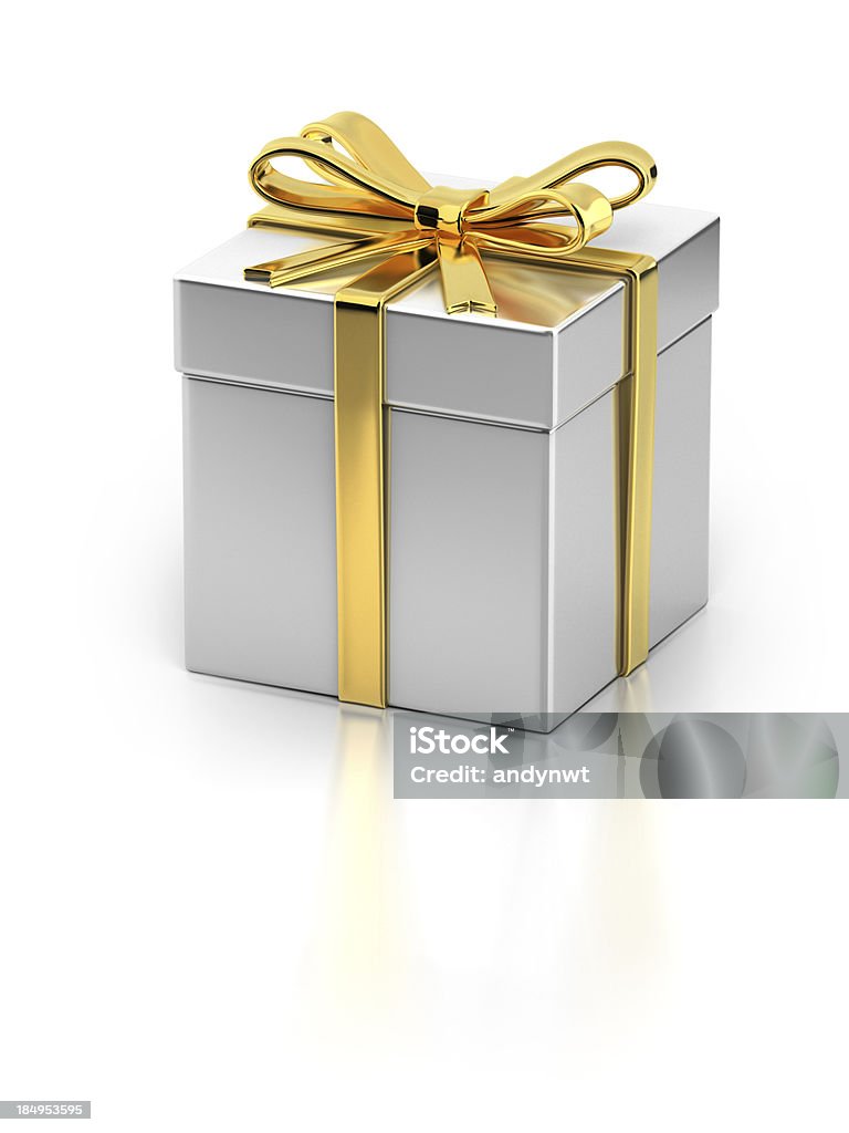 Gift Box with Gold Ribbon A metallic gift box with golden ribbon isolated on white background. Clipping path included. Gold - Metal Stock Photo