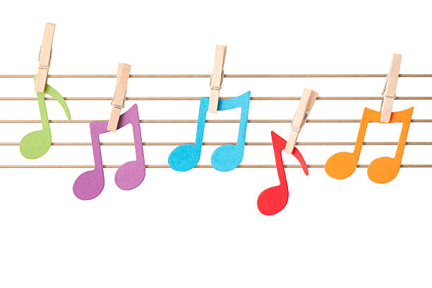 Musical notes pegged to string stave Five musical notes die-cut from colourful card pegged to a string stave. Fun concept shot making learning music more fun for children. Isolated on a pure white background, absolutely no dot in the white area no need to cut-out e.g. can be dropped directly on to a white web page seemlessly. musical note photos stock pictures, royalty-free photos & images