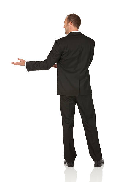 istock Rear view of a businessman gesturing 184954582