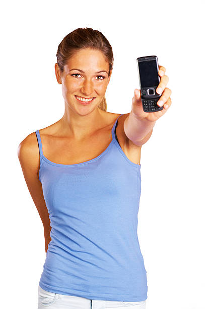 istock Pretty young woman holding mobile phone out 184954973