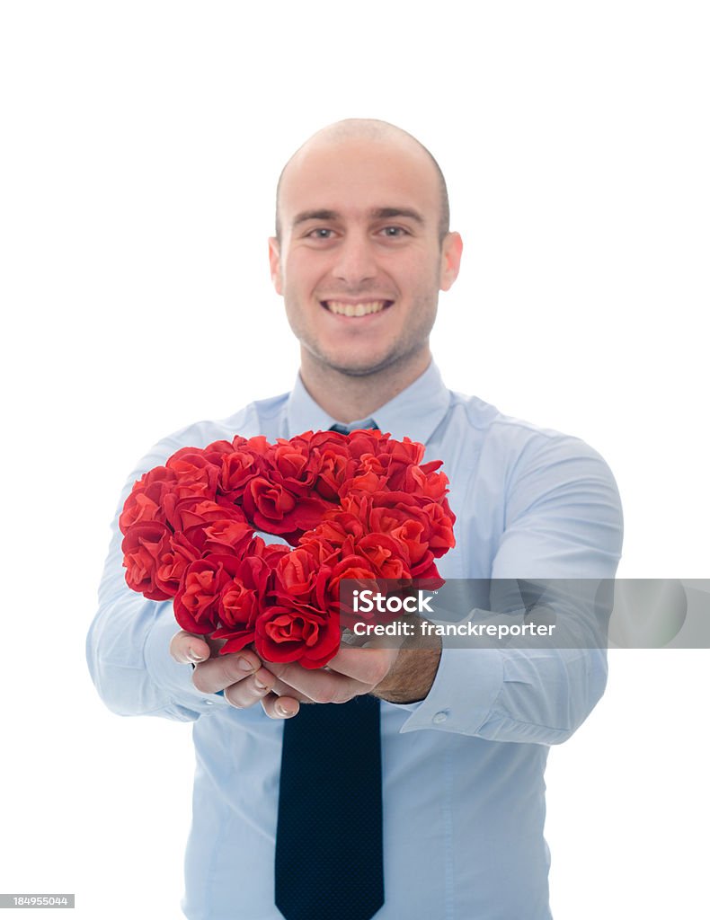 business man holding red bunch of flower for st. valentine business man holding a red bunch of flower for st. valentine 20-24 Years Stock Photo