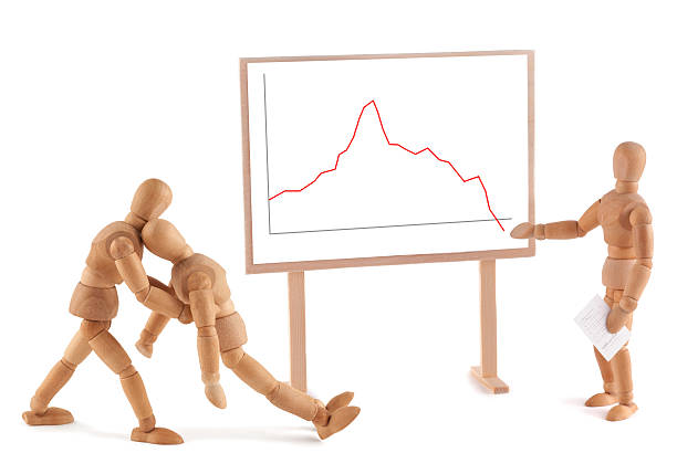 istock Wooden Mannequin and business graph 184955354