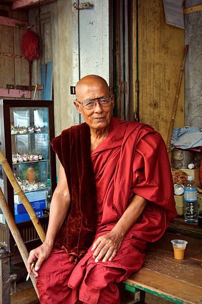 istock Burmese monk with cup of tea in Yangon 184955674