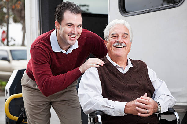 istock Senior man by minibus with wheelchair lift 184955706