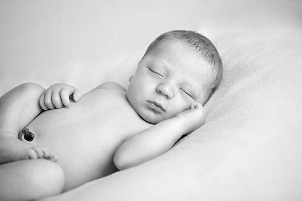 istock Black & White Image of Newborn Baby Sleeping Peacefully 184955743