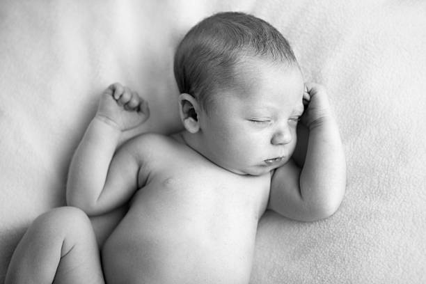 istock Black and White Image of Newborn Baby Sleeping Peacefully 184955760