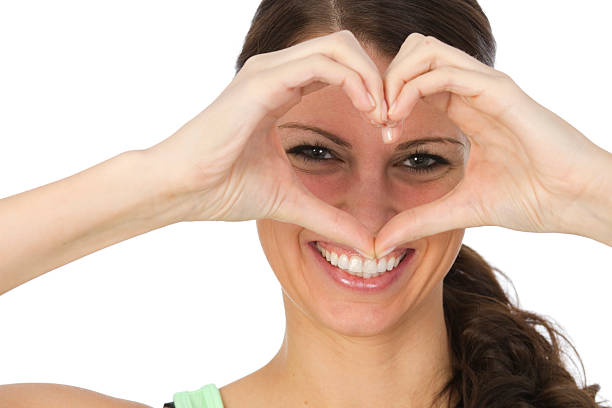 istock woman making heart shape 184956117