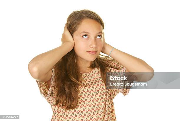 Twelve Year Old Girl Not Listening And Rolling Her Eyes Stock Photo - Download Image Now