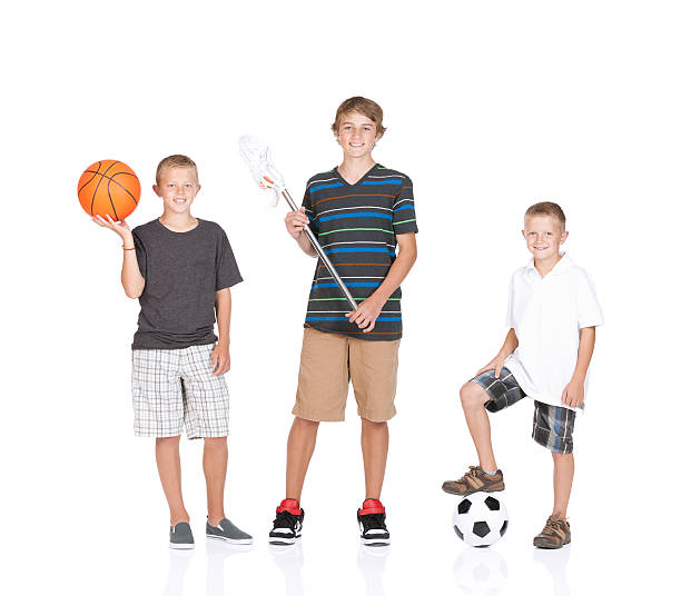 istock Children standing with sports equipment 184956308