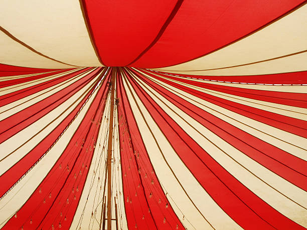 Red and white canopy A two color canopy tent being set for wedding ceremony. circus photos stock pictures, royalty-free photos & images