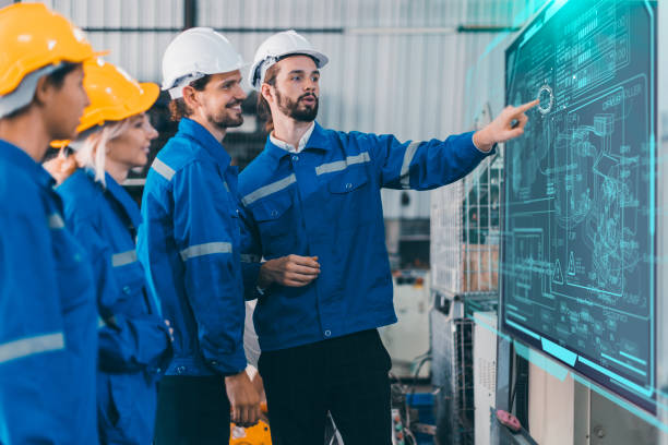 istock Engineer team training employee plan meeting. Plant staff worker safety technician group planning process discussion with digital white board present workflow. 1849567831