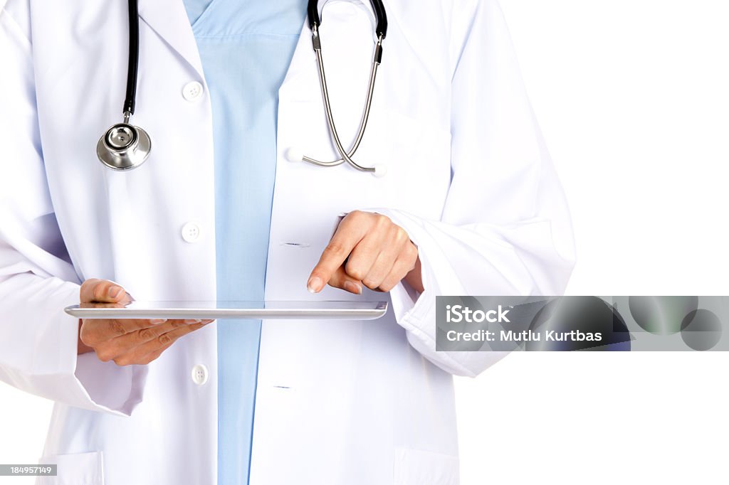 Digital Hospital Young female doctor using tablet. Accidents and Disasters Stock Photo