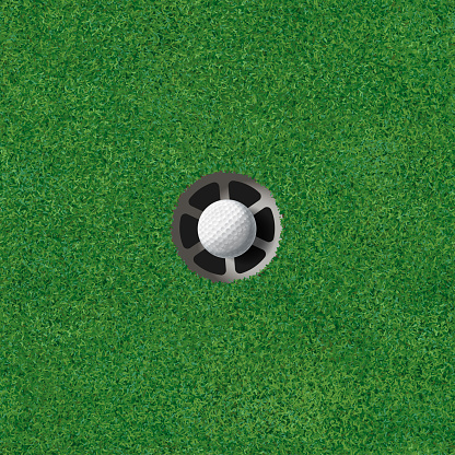 Golf putting green with golf ball in the hole. Seamless repeatable tile. The hole is in the center.