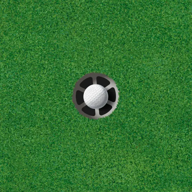 Vector illustration of Golf putting green with golf ball in the hole