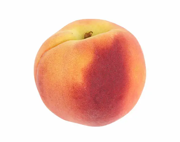 A peach, isolated on white. Shallow depth of field.