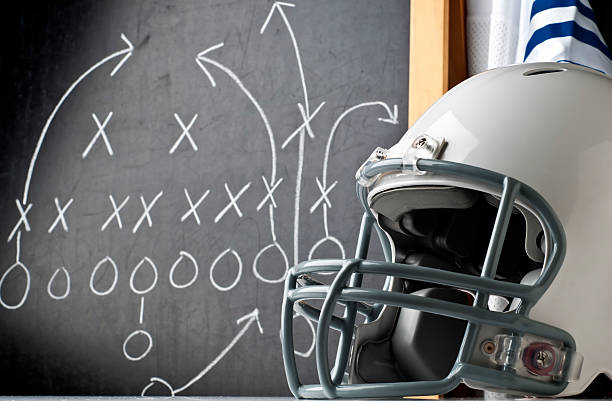 Football Football concept - Please see my portfolio for other sports related images. american football game plan stock pictures, royalty-free photos & images