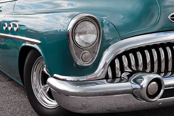 A front-side view of a restored 1953 Buick automobile.