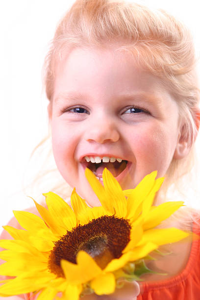 istock Girl Twirling Sunflower 184958217