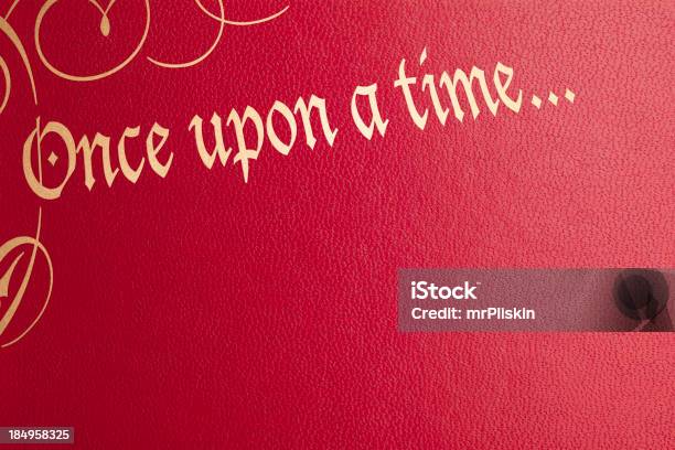 Once Upon A Time Red Leather Book Cover Stock Photo - Download Image Now - Picture Book, Fairy Tale, Book