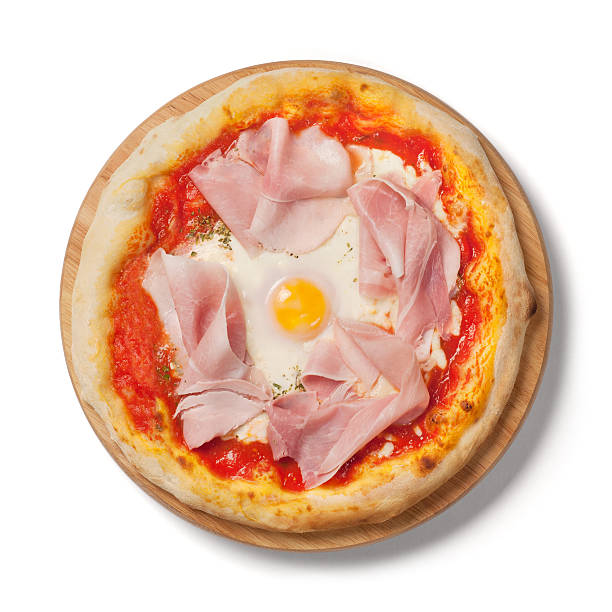 istock Italian pizza with ham and egg, white background, from above 184958449