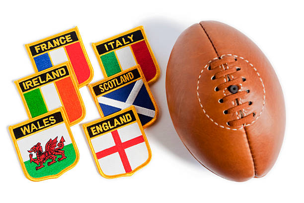 Rugby ball with flag patches from six nations "The Six Nations Championship is an annually contested rugby union competition involving six European teams, England, Ireland, Scotland, Wales, France and Italy, as depicted by the 6 National Flag badges on an isolated white background. Good copy space." alba italy photos stock pictures, royalty-free photos & images