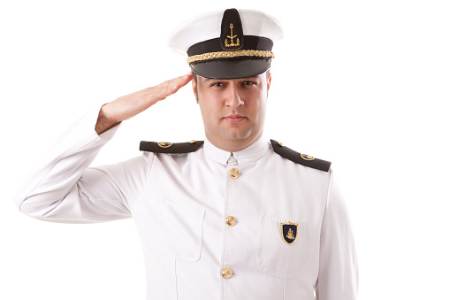 Young captain is saluting.