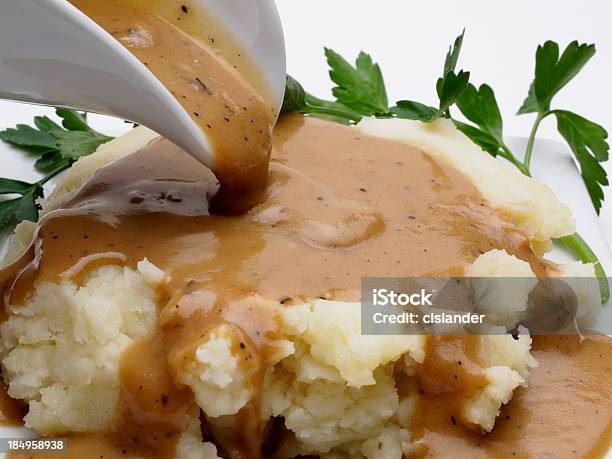Mashed Potatoes And Gravy Stock Photo - Download Image Now - Gravy, Mashed Potatoes, Pouring