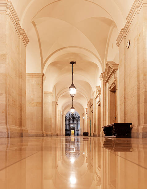 istock Long arched hallway with a wrought iron gate at one end 184959143