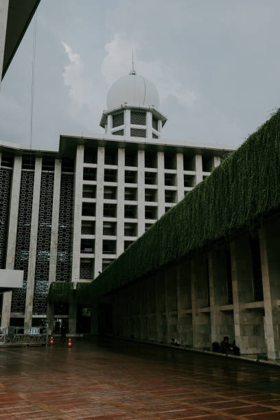 istock Istiqlal Mosque Corner and Dome with Cloud at Noon View From Aside 1849596388