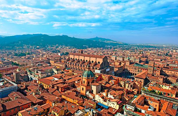 Bologna, Emilia Romagna Bologna skyline with landmarks San Petronio church and Piazza Maggiore. bologna photos stock pictures, royalty-free photos & images