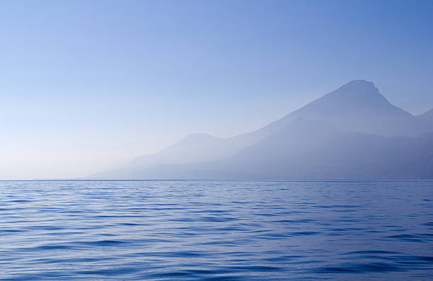 istock blue dreamy sea and mountains 184960013