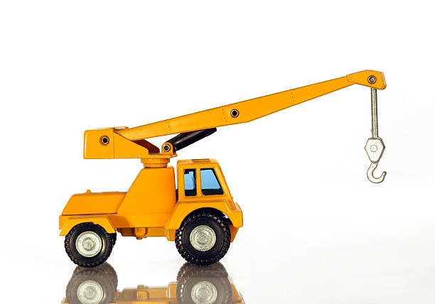 istock Yellow construction crane.  Model.  Isolated on white.  Boom up. 184960148