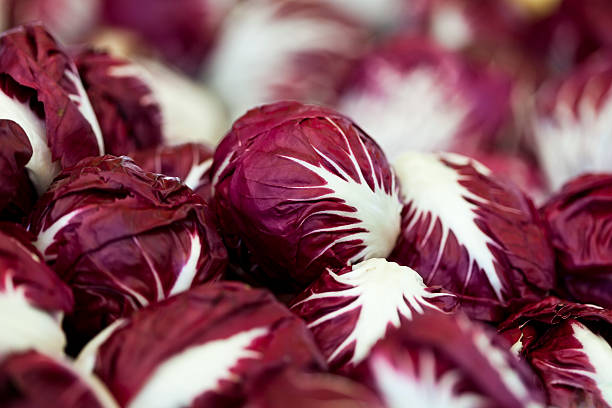 chicory frescos en marketplace - radicchio fotografías e imágenes de stock